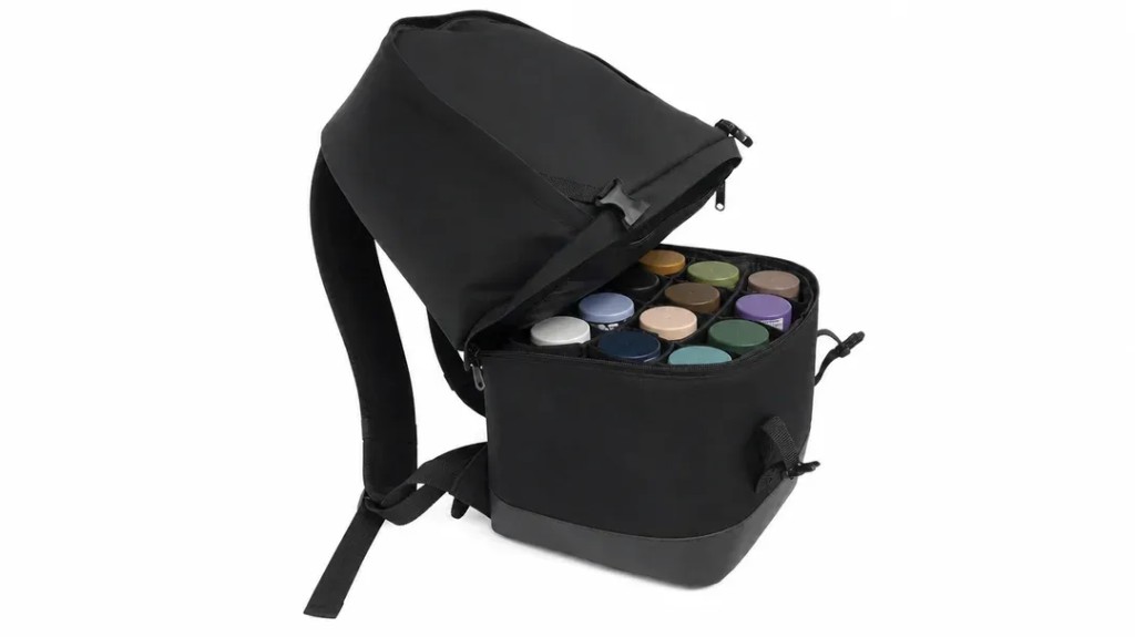 Open black Ring Ready Pack with aerosol grooming cans in the lower compartment